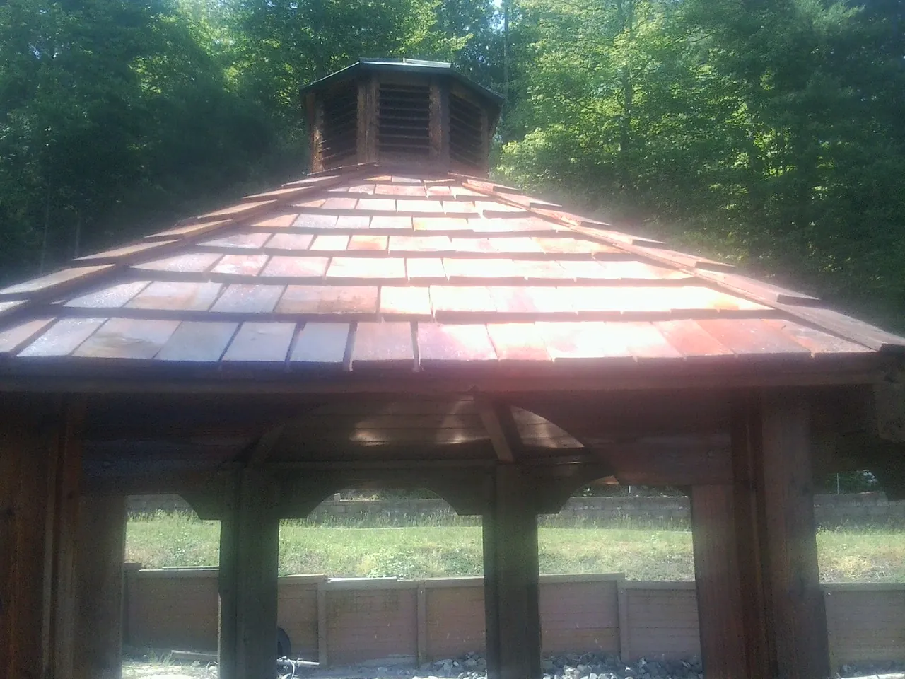 New cedar shake roof and cupola on a lakeside gazebo in Kingston
